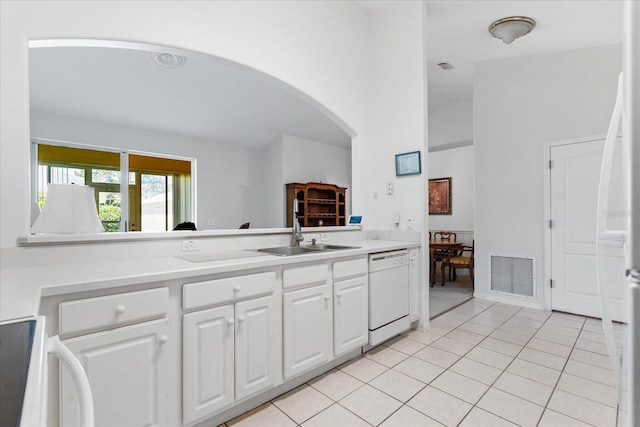 kitchen with visible vents, dishwasher, light tile patterned floors, stove, and a sink