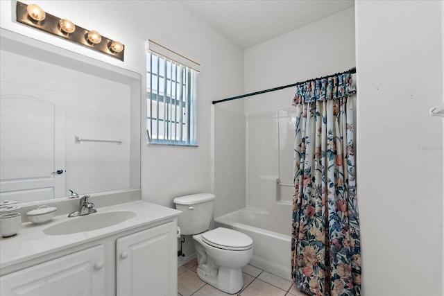 bathroom with vanity, tile patterned floors, shower / tub combo, and toilet