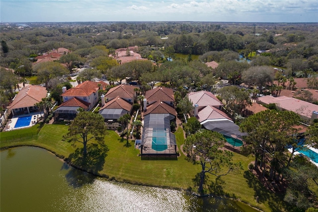 drone / aerial view featuring a residential view and a water view