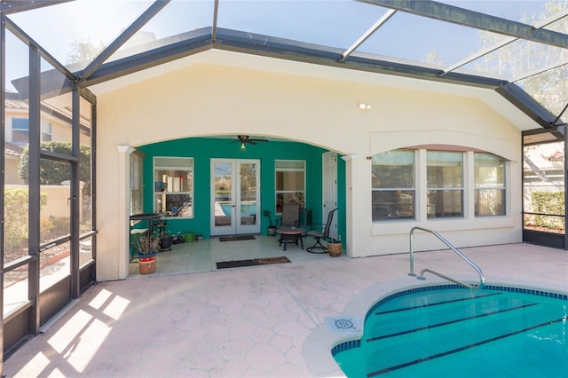 rear view of house featuring french doors, a patio, ceiling fan, and stucco siding