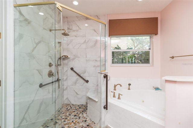 full bathroom featuring recessed lighting, a jetted tub, and a stall shower