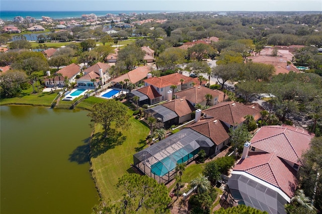 aerial view with a residential view and a water view