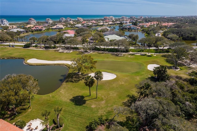 bird's eye view with golf course view and a water view