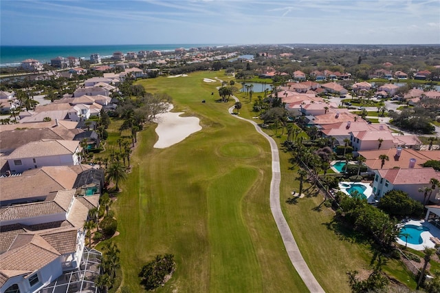 aerial view with a residential view, a water view, and view of golf course