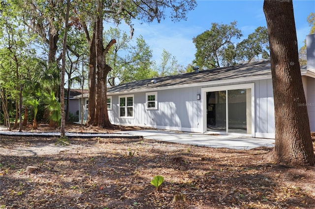 back of house with a patio