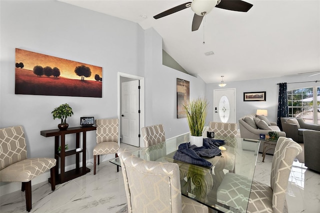 dining room featuring marble finish floor, baseboards, lofted ceiling, and a ceiling fan