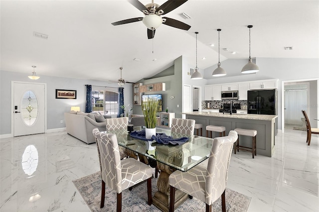 dining room featuring visible vents, marble finish floor, and baseboards