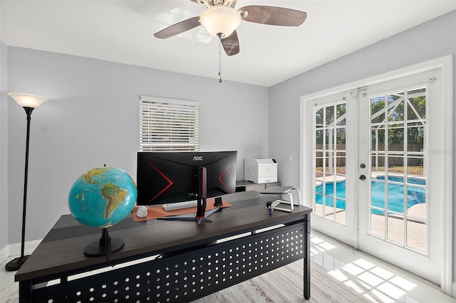 home office featuring plenty of natural light, french doors, and ceiling fan