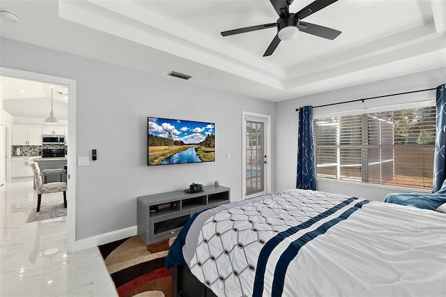 bedroom featuring visible vents, marble finish floor, a tray ceiling, baseboards, and access to exterior