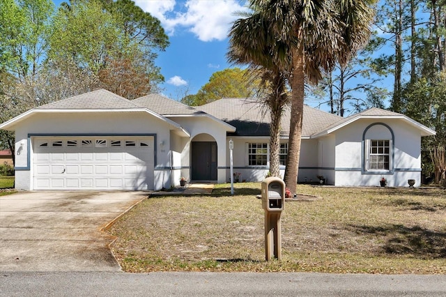 ranch-style house with stucco siding, driveway, a front yard, and a garage