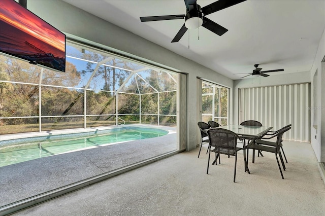 sunroom with a ceiling fan