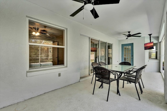 view of patio / terrace featuring outdoor dining space and a ceiling fan