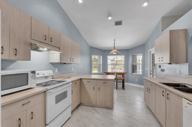 kitchen with visible vents, under cabinet range hood, light countertops, a peninsula, and white appliances