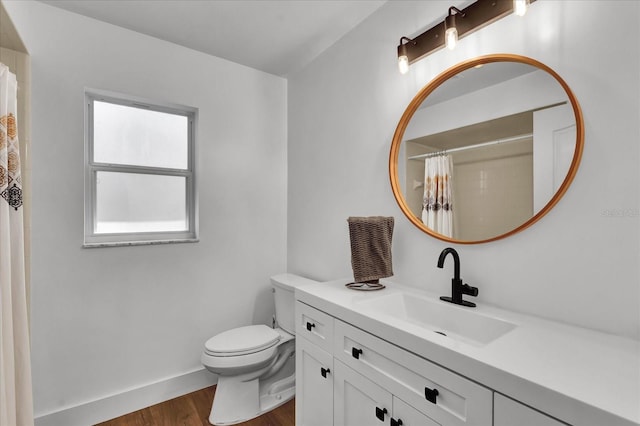 full bathroom with baseboards, toilet, a shower with shower curtain, wood finished floors, and vanity