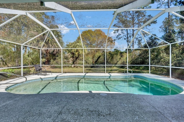 outdoor pool featuring a lanai and a patio area