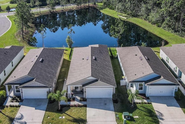 drone / aerial view with a water view