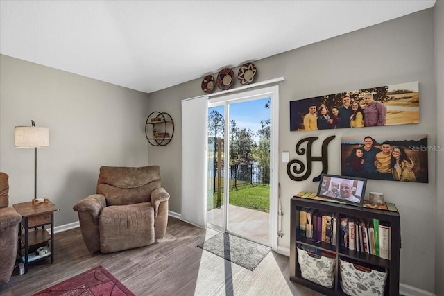 sitting room featuring wood finished floors and baseboards