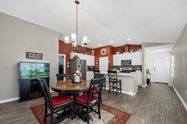 dining space with recessed lighting, baseboards, lofted ceiling, and dark wood-type flooring