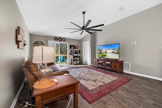 living area featuring wood finished floors, baseboards, visible vents, lofted ceiling, and ceiling fan