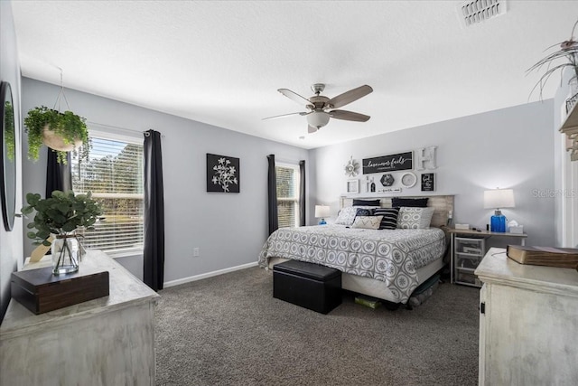 carpeted bedroom featuring visible vents, baseboards, a textured ceiling, and ceiling fan