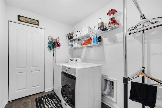 washroom with laundry area, separate washer and dryer, and dark wood-style flooring