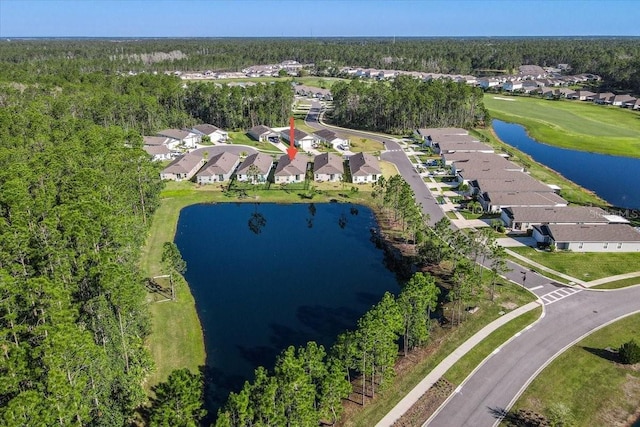 drone / aerial view featuring a residential view and a water view