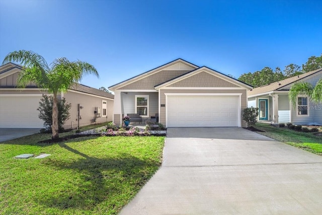 view of front of house featuring a front lawn, an attached garage, and driveway