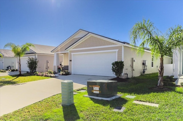 view of front of house featuring an attached garage, concrete driveway, and a front yard