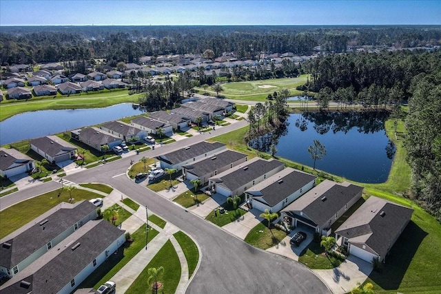 drone / aerial view with a residential view and a water view