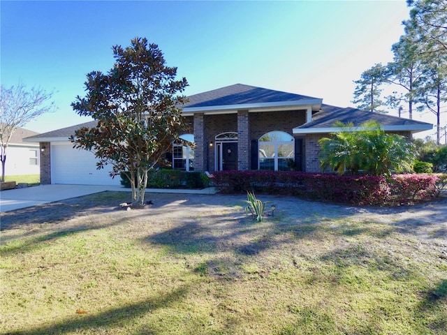 ranch-style home with a front lawn, brick siding, concrete driveway, and an attached garage