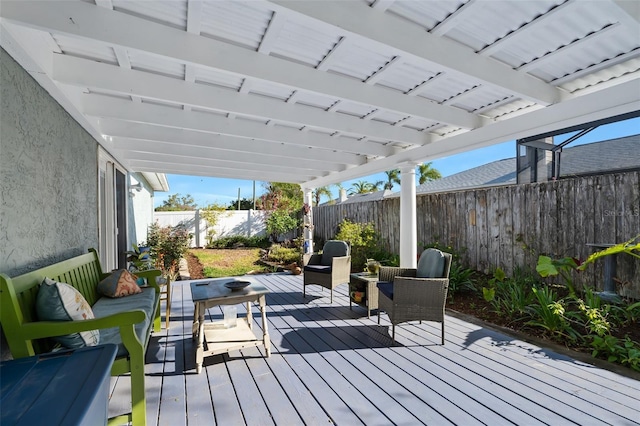 deck with a fenced backyard and an outdoor hangout area