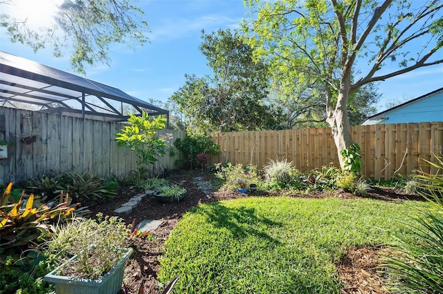 view of yard with a fenced backyard