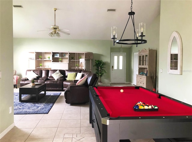 game room with pool table, light tile patterned flooring, ceiling fan with notable chandelier, and visible vents