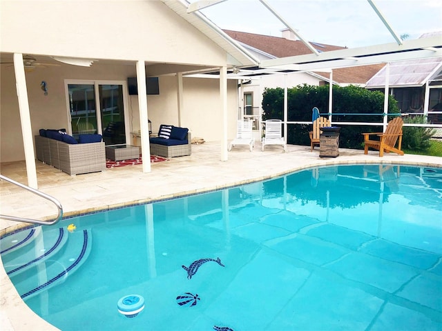 pool with a patio, a ceiling fan, a lanai, and an outdoor hangout area