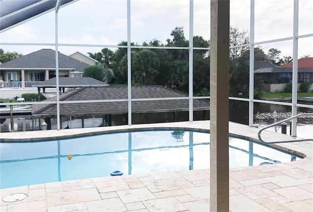 pool with a lanai and a patio