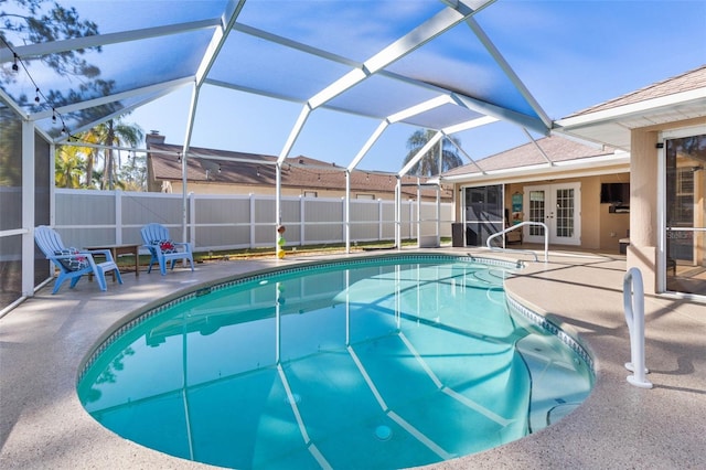 view of pool featuring a fenced in pool, french doors, a patio, and fence