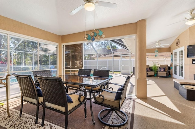 sunroom / solarium with ceiling fan and vaulted ceiling