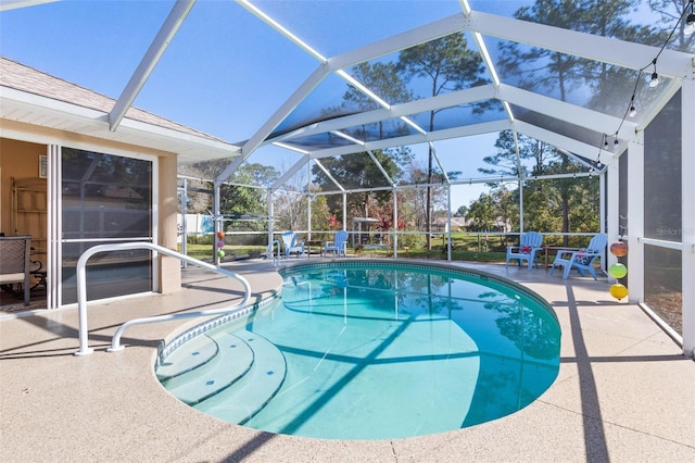 outdoor pool featuring a lanai and a patio area