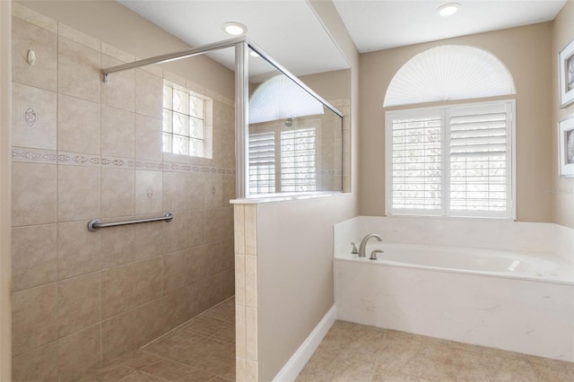 full bathroom featuring tile patterned flooring, a garden tub, recessed lighting, and a walk in shower