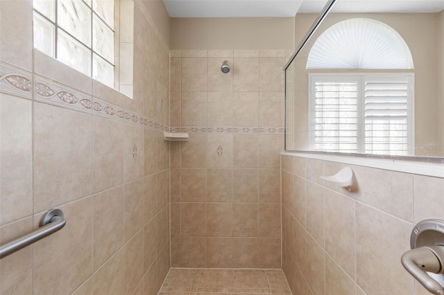 bathroom with tiled shower