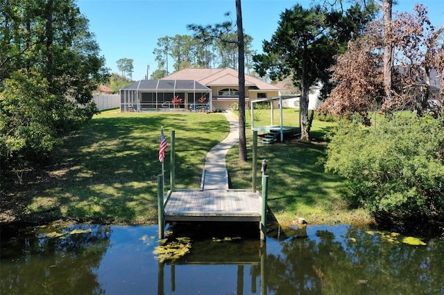 dock area featuring glass enclosure, a water view, and a lawn