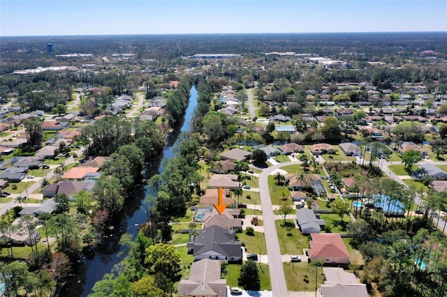 bird's eye view with a residential view and a water view