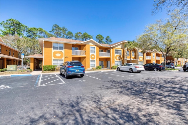 view of property with uncovered parking