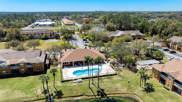 bird's eye view with a residential view and a wooded view