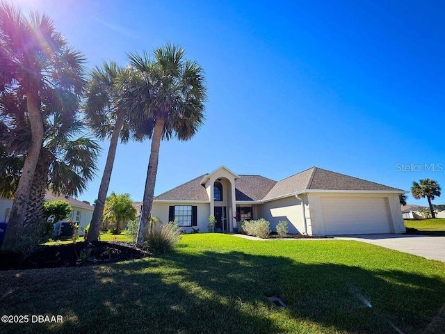 ranch-style house with stucco siding, driveway, a garage, and a front lawn