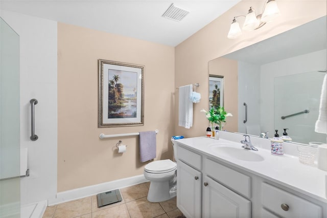 bathroom with vanity, baseboards, visible vents, tile patterned floors, and toilet