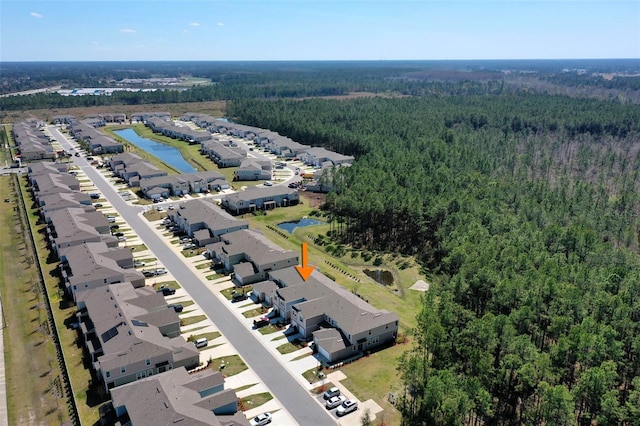 aerial view with a residential view and a wooded view