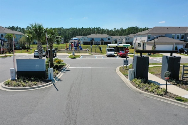 view of street with a residential view, curbs, and sidewalks