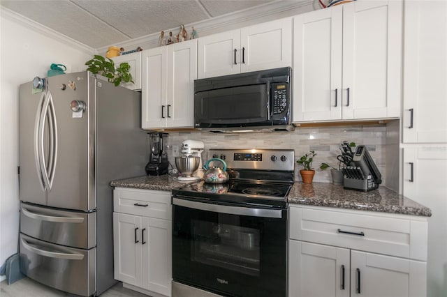 kitchen featuring tasteful backsplash, dark stone counters, ornamental molding, appliances with stainless steel finishes, and white cabinetry