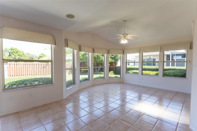 unfurnished sunroom with lofted ceiling and a ceiling fan